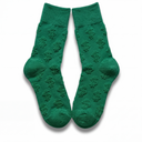 Flat lay of green Money Socks crew socks standing upright, displaying the embossed 3D dollar-sign pattern down each leg