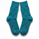 Flat lay of teal Money Socks crew socks standing upright, displaying the embossed 3D dollar-sign pattern down each leg