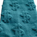 Close-up of teal Money Socks knit texture highlighting the raised 3D dollar-sign detail